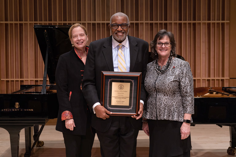 Sally Coveleskie of the Steinway organization is pictured with Marvin V. Curtis, dean of the Raclin School and Susan Elrod, chancellor of IU South Bend