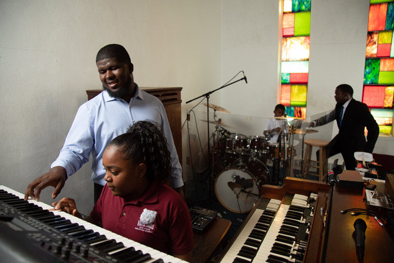 student musicians being mentored by the Butler children