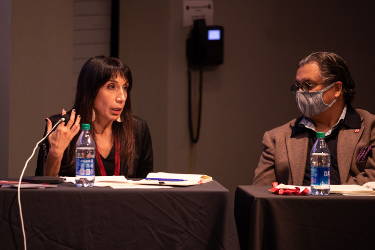 a man and a woman on a panel discussion