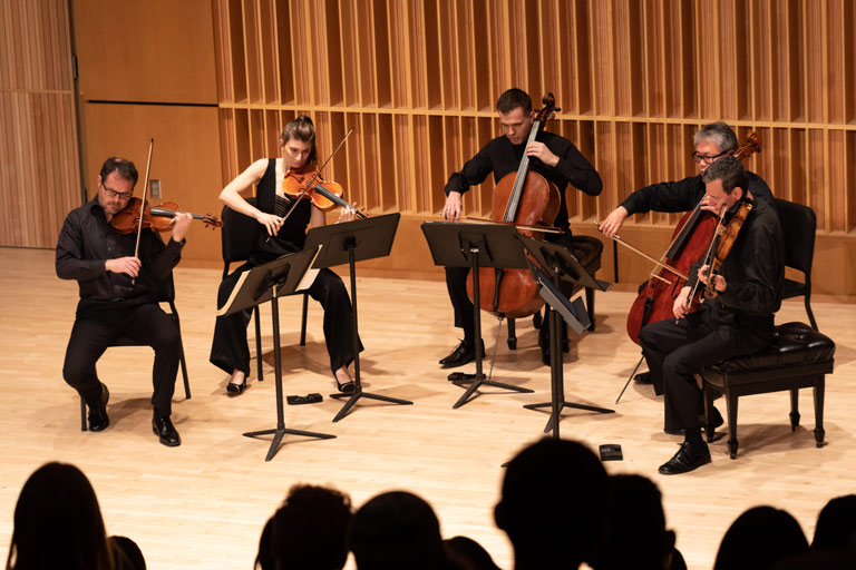 Five strings players performing