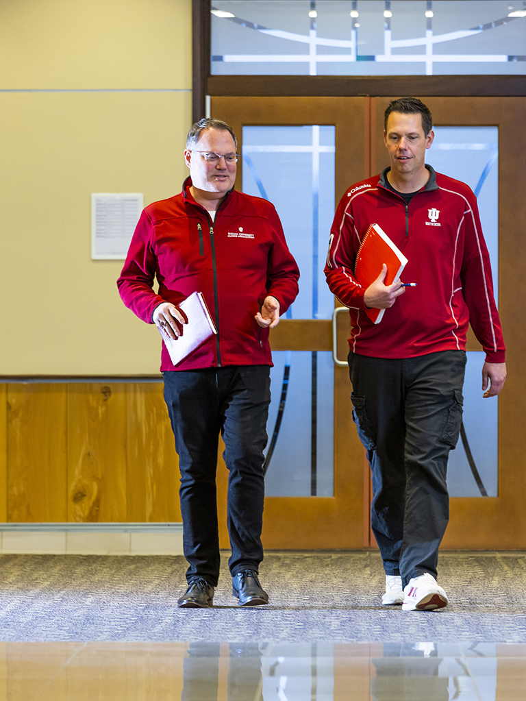 L-R: Rob DeCleene, BS ’94 and Andy Williams BS ’99 MBA ’08 walking